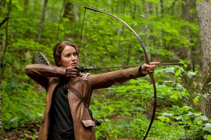 Jennifer Lawrence as Katniss Everdeen from The Hunger Games with bow and arrow