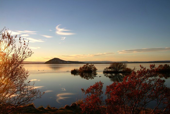Lake Myvatn, Iceland at sunset with a mountain in the distance