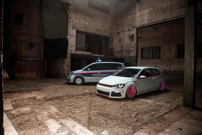 Volkswagen Golf VII and Police Car in Warehouse
