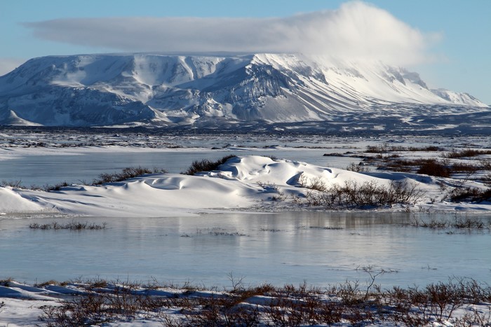 Snowy Mountains and Frozen Lake in Iceland