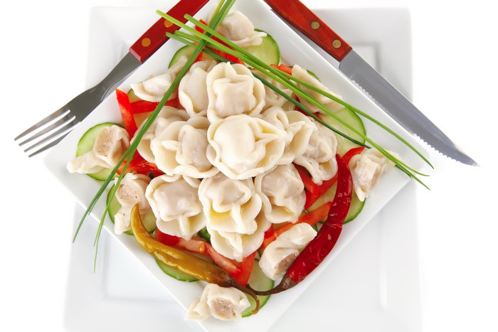 Pelmeni with vegetables and chili peppers