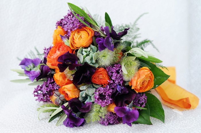 Orange and purple flower bouquet with ribbon