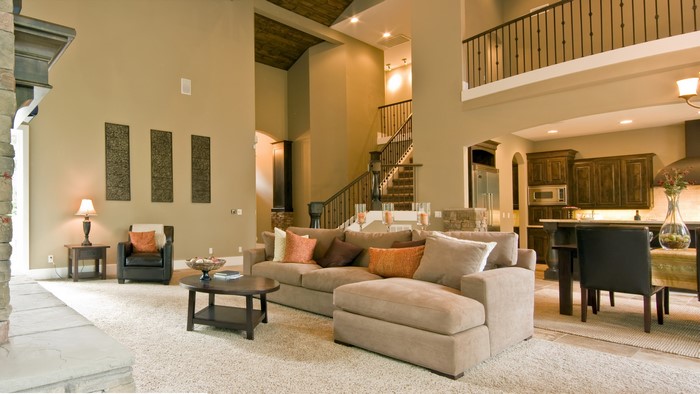 Spacious living room with high ceilings and a modern kitchen