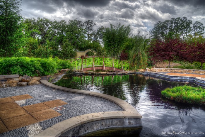 Japanese Garden with Pond and Green Bridge
