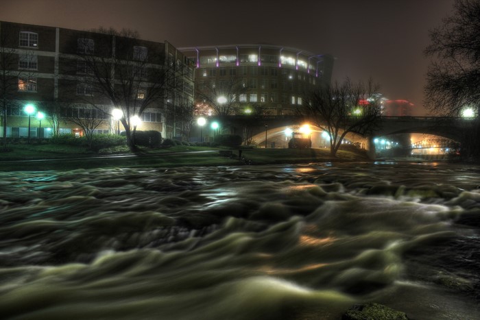 Greenville, USA at Night with River and Bridge