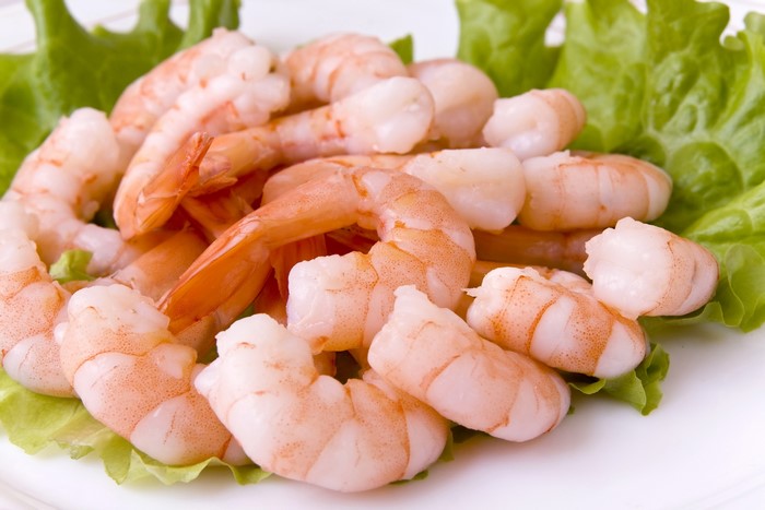 Cooked shrimp on a bed of lettuce