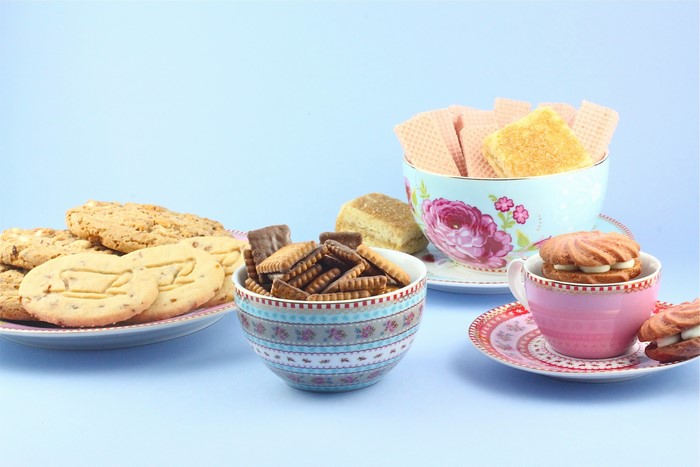 Assortment of cookies and wafers on a blue background