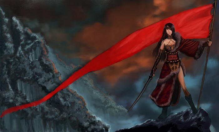 Warrior woman holding a red flag on a mountain