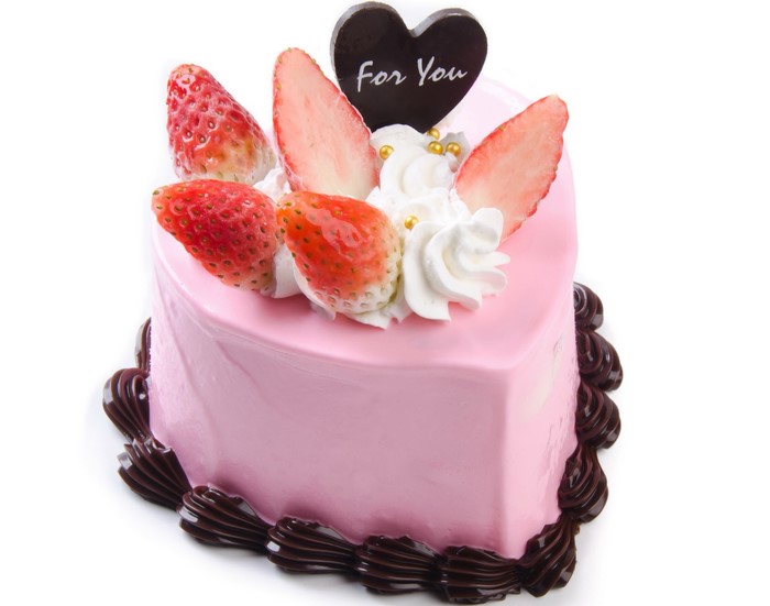 Heart-shaped strawberry cake with chocolate decoration
