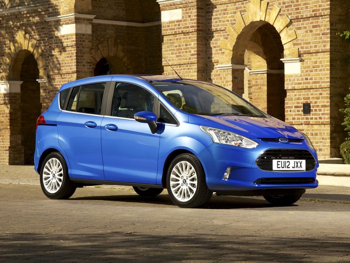 Blue Ford B-Max parked in front of brick building
