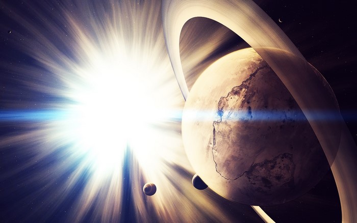 Planet with rings and sun with rays