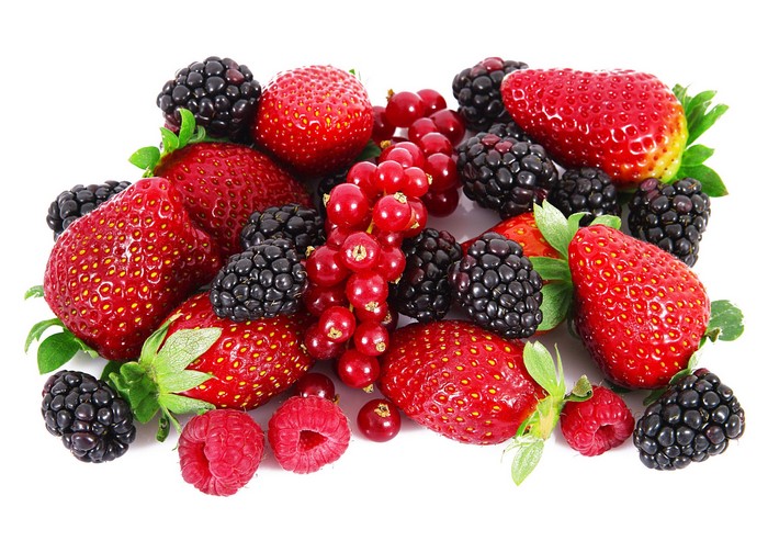 Assortment of fresh berries including strawberries, blackberries, raspberries, and red currants