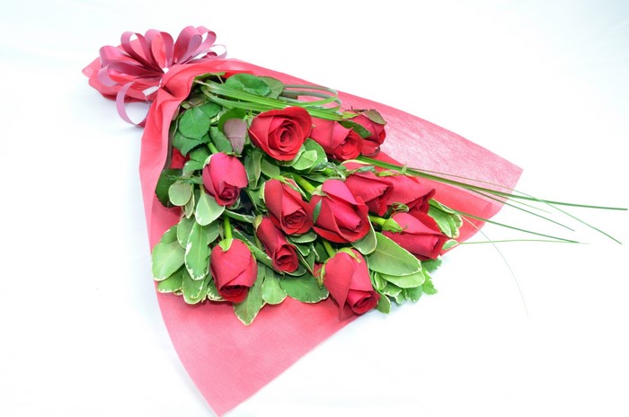 Bouquet of red roses with pink wrapping