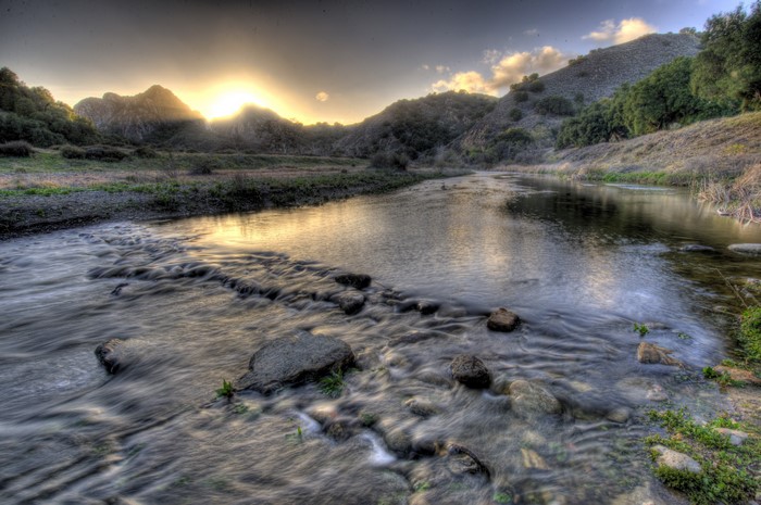River flowing through hills at sunset in Malibu, USA