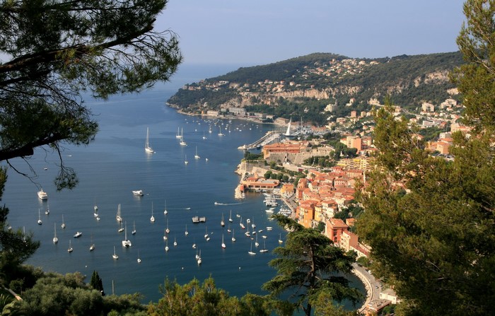 View of a coastal town with a harbor full of sailboats