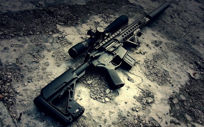 Assault rifle with scope and suppressor