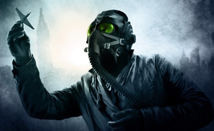 Man in gas mask holding airplane model