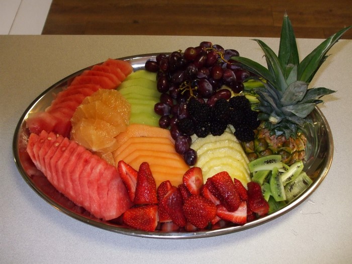 Fruit platter with strawberries, grapes, and pineapple