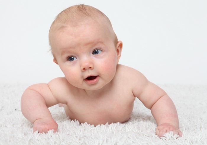 Baby on a white rug