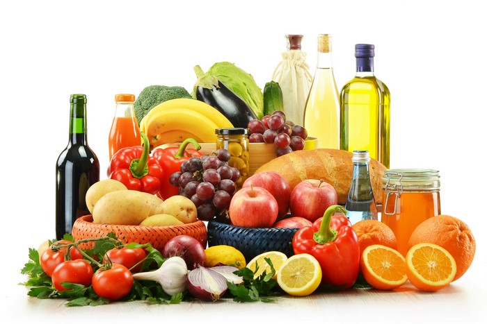 Still-life of fruits, vegetables, and bottles