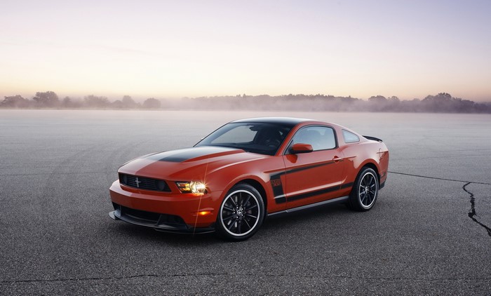Orange 2012 Ford Mustang Boss 302 on Asphalt