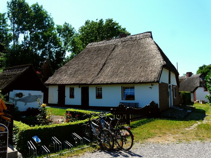 Thatched roof houses with bicycles in Putgarten, Germany