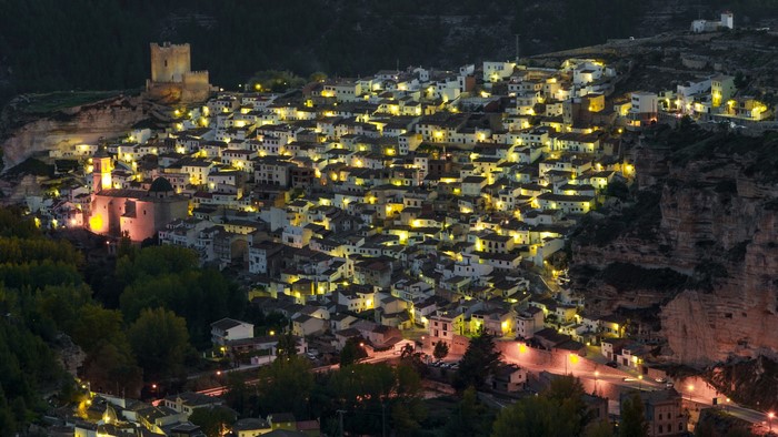 Village with castle at night in Albacete, Spain