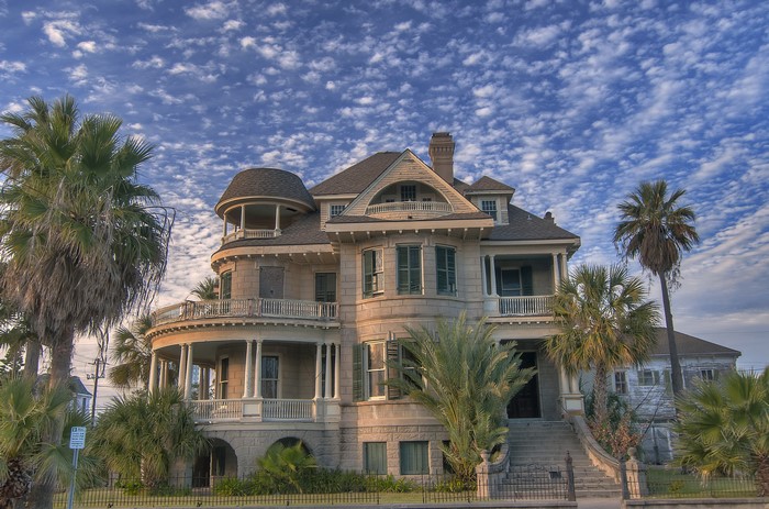 Historic Victorian House with Palm Trees in Galveston, Texas