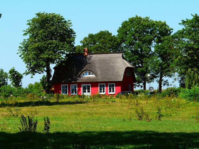 Red house with thatched roof in Putgarten, Germany