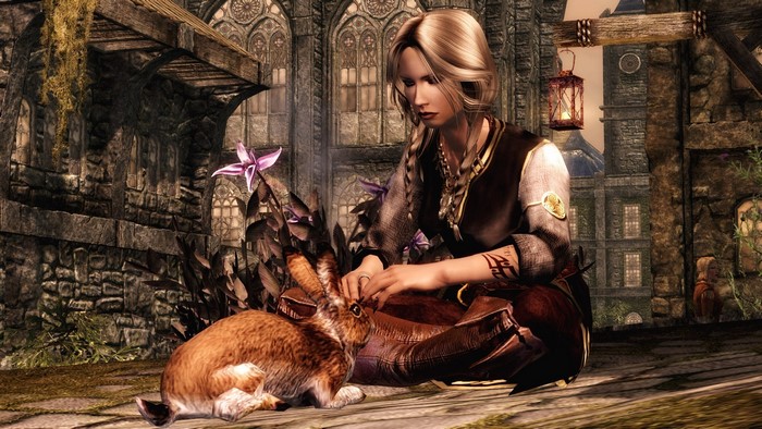 Woman petting a rabbit in Skyrim