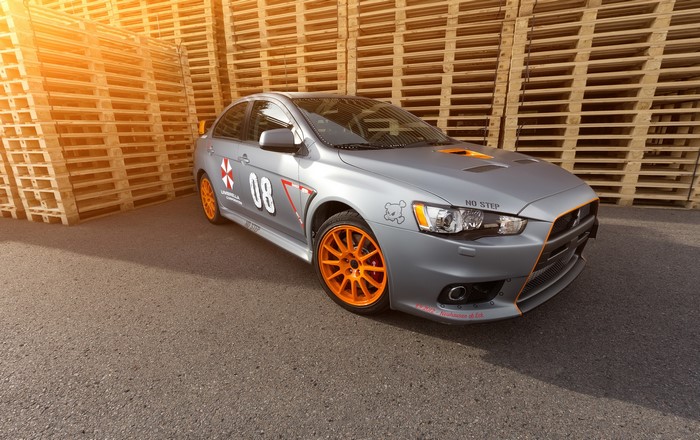 Silver Mitsubishi Lancer Evo X with orange accents