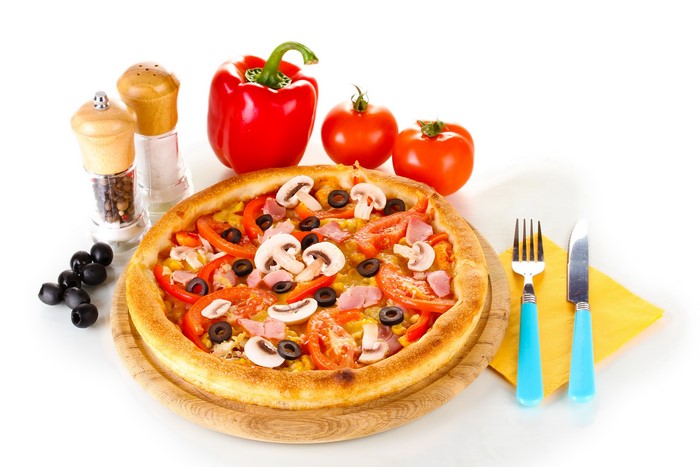 Pizza with mushrooms, tomatoes, olives, and ham