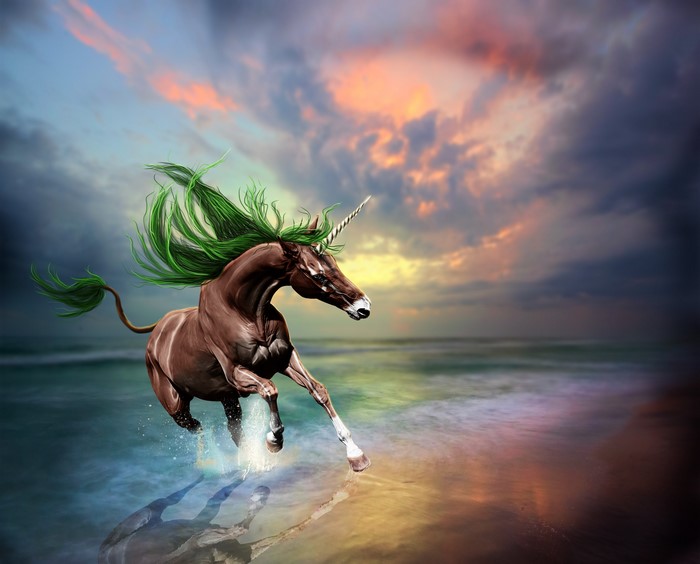 Brown unicorn with green mane running on a beach