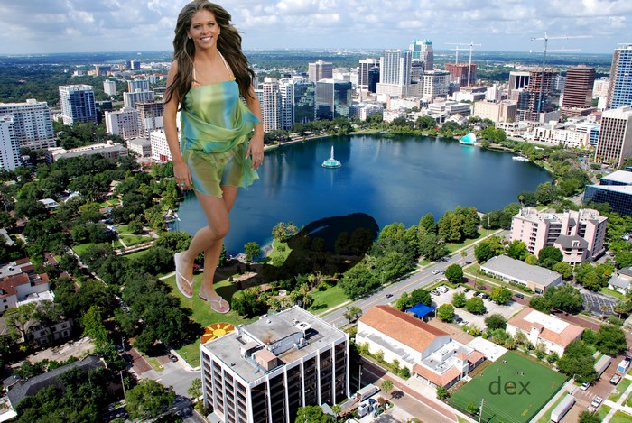 Woman towering over Orlando skyline and Lake Eola