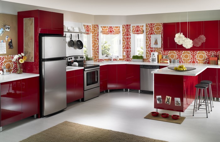 Modern red kitchen with stainless steel appliances