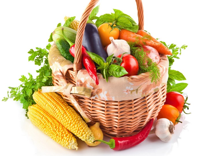 Basket of fresh vegetables and corn