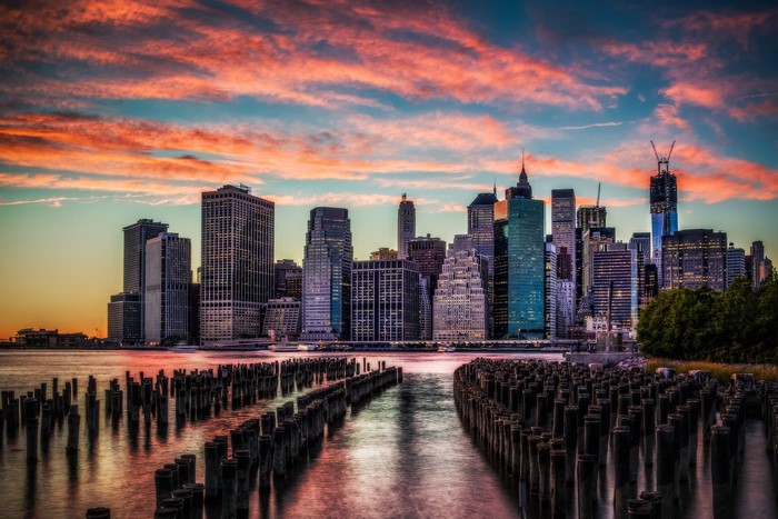New York City skyline at sunset with wooden piers