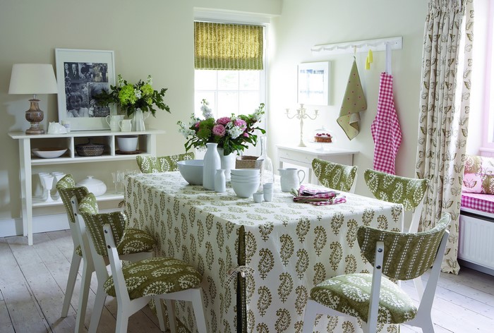 Dining room with paisley tablecloth and floral chairs