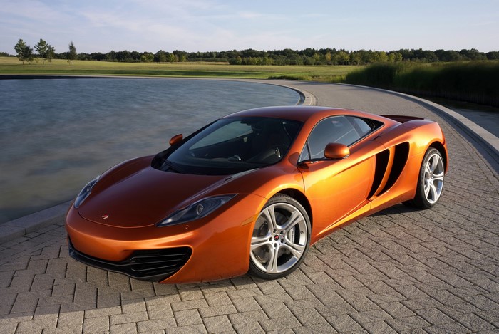 2011 McLaren MP4-12C parked by a pond