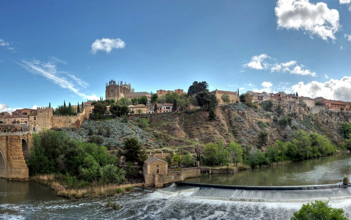 Toledo, Spain: Historic Cityscape with River and Bridge