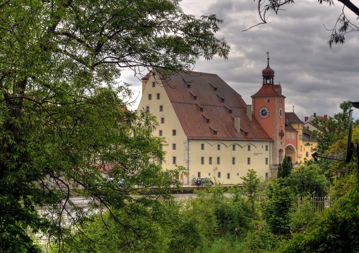 Historic building with clock tower in Regensburg, Germany