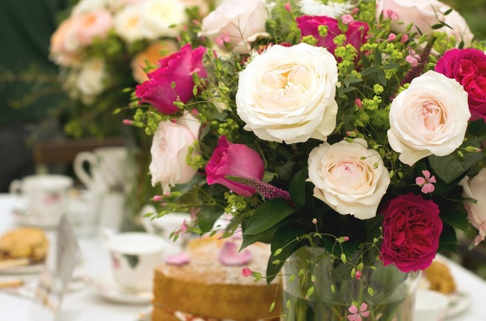 Roses and a cake on a table