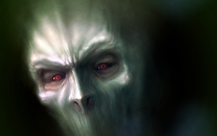 Close-up of a monstrous face with red eyes