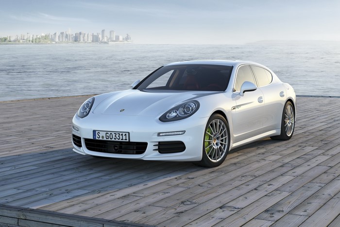 White 2013 Porsche Panamera S E-Hybrid parked on a wooden pier