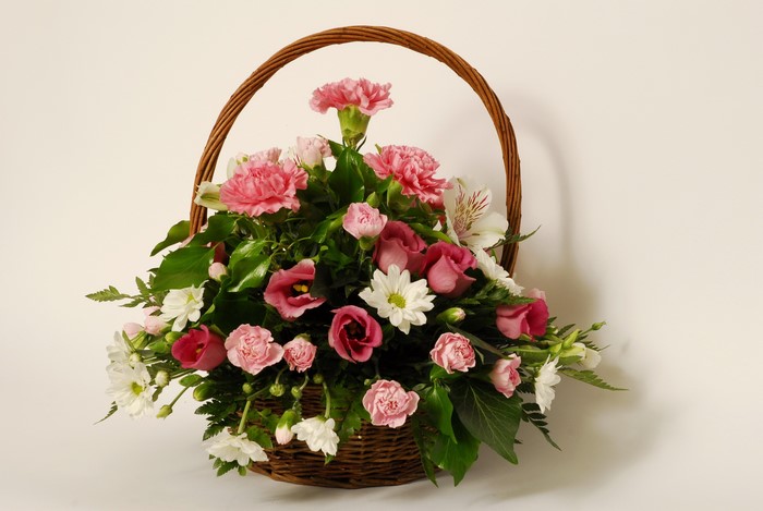 Flower bouquet in a wicker basket