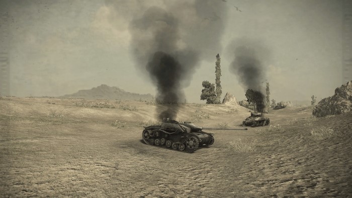 World of Tanks: Two burning tanks in a desert landscape