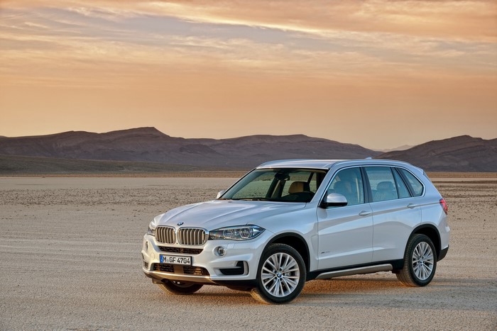 White 2013 BMW X5 in a desert landscape