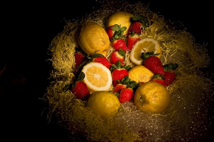 Fruit basket with lemons and strawberries