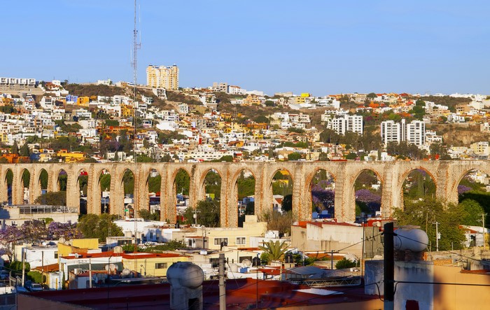 Aqueduct and city on a hill in Mexico