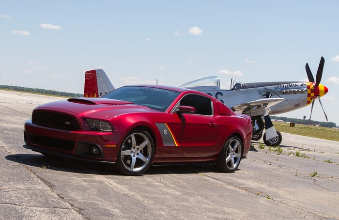 Red 2013 Ford Mustang SR P51 and P-51 Mustang airplane